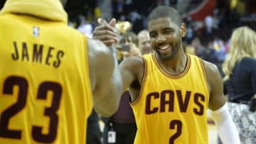 May 12, 2015; Cleveland, OH, USA; Cleveland Cavaliers forward LeBron James (23) celebrates with guard Kyrie Irving (2) after a 106-101 win over the Chicago Bulls in game five of the second round of the NBA Playoffs at Quicken Loans Arena. Mandatory Credit: David Richard-USA TODAY Sports
