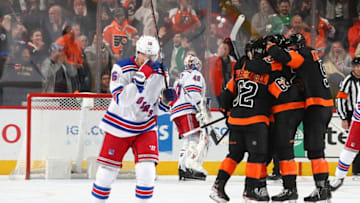 PHILADELPHIA, PA - FEBRUARY 28: Ryan Strome #16 of the New York Rangers skates back to the bench as Nicolas Aube-Kubel #62, James van Riemsdyk #25, and Philippe Myers #5 of the Philadelphia Flyers celebrate a goal by James van Riemsdyk in the second period at the Wells Fargo Center on February 28, 2020 in Philadelphia, Pennsylvania. (Photo by Mitchell Leff/Getty Images)