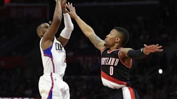 Mar 24, 2016; Los Angeles, CA, USA; Los Angeles Clippers guard Chris Paul (3) attempts a shot defended by Portland Trail Blazers guard Damian Lillard (0) during the second half at Staples Center. The Clippers won 96-94. Mandatory Credit: Kelvin Kuo-USA TODAY Sports