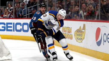 DENVER, CO - APRIL 07: Samuel Girard #49 of the Colorado Avalanche fights for control of the puck against Dmitrij Jaskin #23 of the St Louis Blues at the Pepsi Center on April 7, 2018 in Denver, Colorado. (Photo by Matthew Stockman/Getty Images)