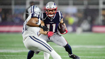FOXBOROUGH, MASSACHUSETTS - NOVEMBER 24: Byron Jones #31 of the Dallas Cowboys attempts to tackle Julian Edelman #11 of the New England Patriots during the first half in the game at Gillette Stadium on November 24, 2019 in Foxborough, Massachusetts. (Photo by Billie Weiss/Getty Images)