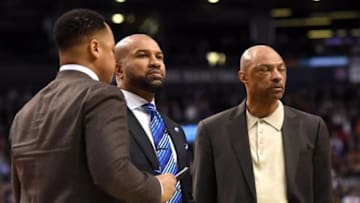 Jan 28, 2016; Toronto, Ontario, CAN; New York Knicks head coach Derek Fisher (centre) prepares to draw up a play with assistant coaches Jim Cleamons (right) and Rasheed Hazzard durng a time out against Toronto Raptors at Air Canada Centre. The Knicks lost 103-93.Mandatory Credit: Dan Hamilton-USA TODAY Sports