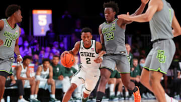 Nov 26, 2021; Nassau, BHS; Michigan State Spartans guard Tyson Walker (2) dribbles the ball while defended by Baylor Bears forward Jonathan Tchamwa Tchatchoua (23) during the first half at Imperial Arena. Mandatory Credit: Kevin Jairaj-USA TODAY Sports
