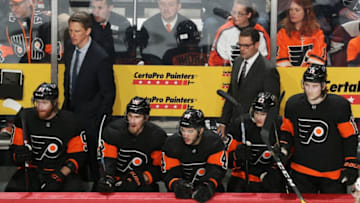 PHILADELPHIA, PA - DECEMBER 22: Assistant Coach Kris Knoblauch and Head Coach of the Philadelphia Flyers Scott Gordon look on during the first period of their game against the Columbus Blue Jackets on December 22, 2018 at the Wells Fargo Center in Philadelphia, Pennsylvania. (Photo by Len Redkoles/NHLI via Getty Images)