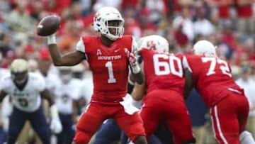Nov 27, 2015; Houston, TX, USA; Houston Cougars quarterback Greg Ward Jr. (1) attempts a pass during the fourth quarter against the Navy Midshipmen at TDECU Stadium. The Cougars defeated the Midshipmen 52-31. Mandatory Credit: Troy Taormina-USA TODAY Sports