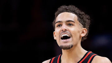ATLANTA, GEORGIA - MARCH 11: Trae Young #11 of the Atlanta Hawks reacts after a three-point basket by Kevin Huerter #3 against the Los Angeles Clippers during the second half at State Farm Arena on March 11, 2022 in Atlanta, Georgia. NOTE TO USER: User expressly acknowledges and agrees that, by downloading and or using this photograph, User is consenting to the terms and conditions of the Getty Images License Agreement. (Photo by Kevin C. Cox/Getty Images)