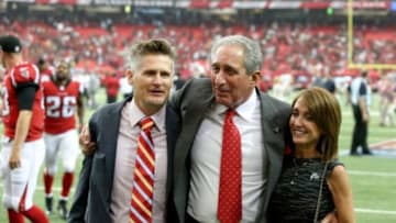 Sep 7, 2014; Atlanta, GA, USA; Atlanta Falcons general manager Thomas Dimitroff, Atlanta Falcons owner Arthur Blank and Angela Macuga celebrate the Falcons