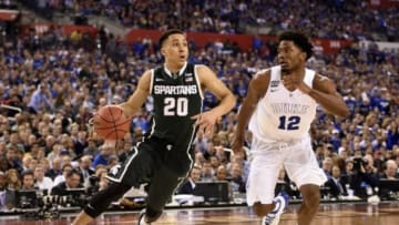 Apr 4, 2015; Indianapolis, IN, USA; Michigan State Spartans guard Travis Trice (20) drives against Duke Blue Devils forward Justise Winslow (12) in the second half of the 2015 NCAA Men