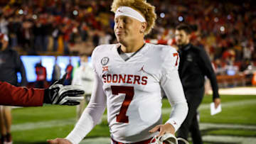 Oct 3, 2020; Ames, Iowa, USA; Oklahoma quarterback Spencer Rattler (7) walks off the field after the Sooners fell to Iowa State 37-30. Mandatory Credit: Brian Powers-USA TODAY Sports