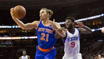 Jan 21, 2015; Philadelphia, PA, USA; New York Knicks forward Lou Amundson (21) and Philadelphia 76ers guard JaKarr Sampson (9) battle for a rebound during the second quarter at Wells Fargo Center. Mandatory Credit: Bill Streicher-USA TODAY Sports