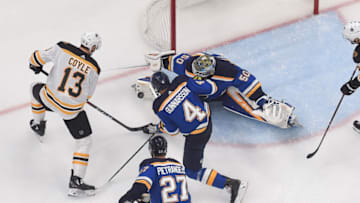 ST. LOUIS, MO - JUNE 1: Jordan Binnington #50 of the St. Louis Blues blocks a shot from Charlie Coyle #13 of the Boston Bruins in Game Three of the 2019 NHL Stanley Cup Final at Enterprise Center on June 1, 2019 in St. Louis, Missouri. (Photo by Joe Puetz/NHLI via Getty Images)