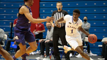 Kansas junior guard Tyon Grant-Foster runs a route through TCU players in the second half of Thursday's game inside Allen Fieldhouse. The Jayhawks won 59-51.Tyon Grant Foster Ku Tcu 01282021 En 2