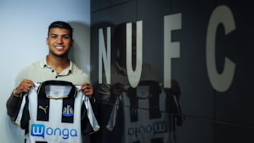 NEWCASTLE, ENGLAND - AUGUST 24: (EXCLUSIVE COVERAGE) DeAndre Yedlin poses for a photograph with the NUFC sign holding a club shirt after signing a 5 year contract at St.James' Park on August 24, 2016, in Newcastle upon Tyne, England. (Photo by Serena Taylor/Newcastle United via Getty Images)
