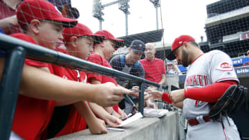 DETROIT, MI - AUGUST 1: Eugenio Suarez #7 of the Cincinnati Reds signs autographs for fans before a game against the Detroit Tigers at Comerica Park on August 1, 2018 in Detroit, Michigan. (Photo by Duane Burleson/Getty Images)