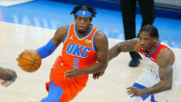 OKC Thunder wing Luguentz Dort (5) goes past Eric Bledsoe (5) during a game April 29.dort