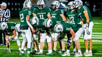 Dartmouth's Jackson Hart runs the huddle.