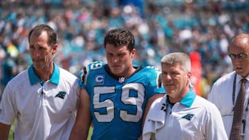 Sep 13, 2015; Jacksonville, FL, USA; Carolina Panthers middle linebacker Luke Kuechly (59) leaves the field after suffering a concussion during the game against the Jacksonville Jaguars at EverBank Field. The Panthers defeat the Jaguars 20-9. Mandatory Credit: Jerome Miron-USA TODAY Sports