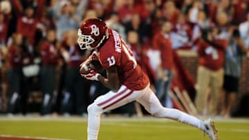 Nov 7, 2015; Norman, OK, USA; Oklahoma Sooners wide receiver Dede Westbrook (11) catches a touchdown pass against the Iowa State Cyclones during the first quarter at Gaylord Family - Oklahoma Memorial Stadium. Mandatory Credit: Mark D. Smith-USA TODAY Sports