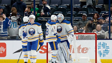 COLUMBUS, OH - DECEMBER 07: Ukko-Pekka Luukkonen #1 of the Buffalo Sabres is congratulated by Zemgus Girgensons #28 after defeating the Columbus Blue Jackets at Nationwide Arena on December 7, 2022 in Columbus, Ohio. Buffalo defeated Columbus 9-4. (Photo by Kirk Irwin/Getty Images)