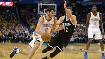 Nov 18, 2016; Oklahoma City, OK, USA; Oklahoma City Thunder guard Alex Abrines (8) drives to the basket in front of Brooklyn Nets forward Joe Harris (12) during the fourth quarter at Chesapeake Energy Arena. Mandatory Credit: Mark D. Smith-USA TODAY Sports