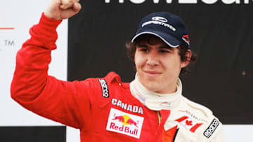 TAUPO, NEW ZEALAND - JANUARY 20: Robert Wickens of Canada celebrates on the podium after his second place finish in the Feature Race at the New Zealand round of the A1GP World Cup Of Motorsport at the Taupo motorsport Park on January 20, 2008 in Taupo, New Zealand. (Photo by Ross Land/Getty Images)