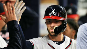 ATLANTA, GA - APRIL 20: Dansby Swanson #7 of the Atlanta Braves celebrates scoring on a Ryan Flaherty #27 RBI double during the fourth inning against the New York Mets at SunTrust Park on April 20, 2018 in Atlanta, Georgia. (Photo by Daniel Shirey/Getty Images)