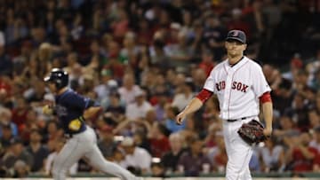 Aug 30, 2016; Boston, MA, USA; Boston Red Sox starting pitcher Clay Buchholz (11) reacts after a solo go ahead home run by Tampa Bay Rays third baseman Evan Longoria (back) in the eighth inning at Fenway Park. Mandatory Credit: David Butler II-USA TODAY Sports