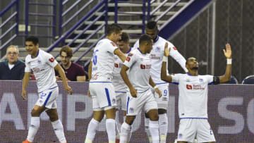 MONTREAL, QC - MARCH 10: Jerry Bengtson #27 of CD Olimpia celebrates a goal with teammates in the first half during the 1st leg of the CONCACAF Champions League quarterfinal game against the Montreal Impact at Olympic Stadium on March 10, 2020 in Montreal, Quebec, Canada. (Photo by Minas Panagiotakis/Getty Images)