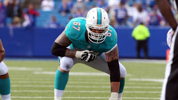 Sep 14, 2014; Orchard Park, NY, USA; Miami Dolphins guard Daryn Colledge (67) during a game against the Buffalo Bills at Ralph Wilson Stadium. Buffalo beats Miami 29 to 10. Mandatory Credit: Timothy T. Ludwig-USA TODAY Sports