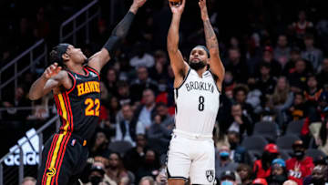 Dec 10, 2021; Atlanta, Georgia, USA; Brooklyn Nets guard Patty Mills (8) shoots over Atlanta Hawks forward Cam Reddish (22) during the first half at State Farm Arena. Mandatory Credit: Dale Zanine-USA TODAY Sports