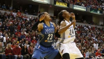 Oct 11, 2015; Indianapolis, IN, USA; Indiana Fever forward Tamika Catchings (24) battles for rebounding position against Minnesota Lynx forward Maya Moore (23) during game four of the WNBA Finals at Bankers Life Fieldhouse. Indiana won 75-69. Mandatory Credit: Brian Spurlock-USA TODAY Sports