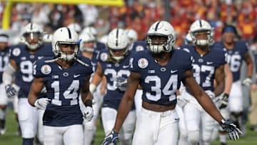 Jan 2, 2017; Pasadena, CA, USA; Penn State Nittany Lions defensive end Shane Simmons (34) and cornerback Zech McPhearson (14) enter the field before the 2017 Rose Bowl game against the USC Trojans at Rose Bowl. Mandatory Credit: Kirby Lee-USA TODAY Sports
