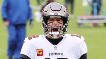 GREEN BAY, WISCONSIN - JANUARY 24: Tom Brady #12 of the Tampa Bay Buccaneers warms up prior to their NFC Championship game against the Green Bay Packers at Lambeau Field on January 24, 2021 in Green Bay, Wisconsin. (Photo by Stacy Revere/Getty Images)