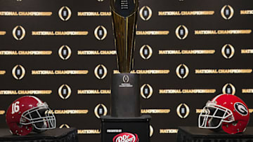 ATLANTA, GA - JANUARY 07: Detail of the College Football Playoff National Championship trophy, along with the helmets of the 2 competing teams, University of Alabama (left) and University of Georgia (right) on January 7, 2018 in Atlanta, Georgia. (Photo by Mike Zarrilli/Getty Images)