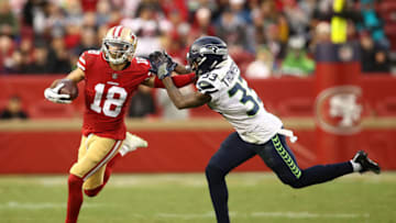 SANTA CLARA, CA - DECEMBER 16: Dante Pettis #18 of the San Francisco 49ers runs after a catch against Tedric Thompson #33 of the Seattle Seahawks during their NFL game at Levi's Stadium on December 16, 2018 in Santa Clara, California. (Photo by Ezra Shaw/Getty Images)