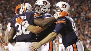 Oct 22, 2016; Auburn, AL, USA; Auburn Tigers running back Kamryn Pittway (36) celebrates a touchdown with fullback Chandler Cox (27) and quarterback Sean White (13) during the third quarter against the Arkansas Razorbacks at Jordan Hare Stadium. The Tigers beat the Razorbacks 56-3. Mandatory Credit: John Reed-USA TODAY Sports