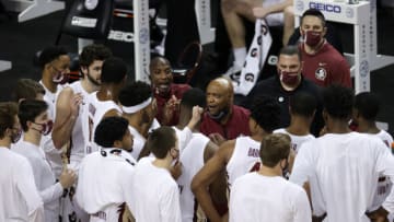 GREENSBORO, NORTH CAROLINA - MARCH 13: Head coach Leonard Hamilton of the Florida State Seminoles speaks with his team under a timeout during the first half of the ACC Men's Basketball Tournament championship game against the Georgia Tech Yellow Jackets at Greensboro Coliseum on March 13, 2021 in Greensboro, North Carolina. (Photo by Jared C. Tilton/Getty Images)
