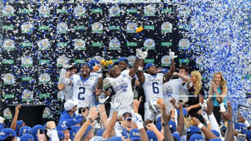 Jan 1, 2019; Orlando, FL, USA; The Kentucky Wildcats celebrate after defeating the Penn State Nittany Lions in the 2019 Citrus Bowl at Camping World Stadium. Mandatory Credit: Jasen Vinlove-USA TODAY Sports