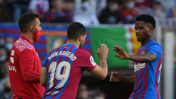 Barcelona's Spanish midfielder Ansu Fati (R) is substituted with Barcelona's Argentinian forward Kun Aguero. (Photo by LLUIS GENE/AFP via Getty Images)