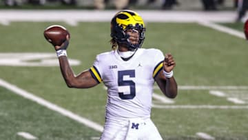Nov 21, 2020; Piscataway, New Jersey, USA; Michigan Wolverines quarterback Joe Milton (5) throws the ball against the Rutgers Scarlet Knights during the first half at SHI Stadium. Mandatory Credit: Vincent Carchietta-USA TODAY Sports