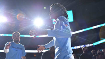 MEMPHIS, TENNESSEE - JANUARY 14: Ja Morant #12 of the Memphis Grizzlies enters the game against the Dallas Mavericks at FedExForum on January 14, 2022 in Memphis, Tennessee. NOTE TO USER: User expressly acknowledges and agrees that, by downloading and or using this photograph, User is consenting to the terms and conditions of the Getty Images License Agreement. (Photo by Justin Ford/Getty Images)
