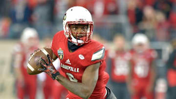 Dec 30, 2015; Nashville, TN, USA; Louisville Cardinals quarterback Lamar Jackson (8) looks to pass against the Texas A&M Aggies during the first half of the 2015 Music City Bowl at Nissan Stadium. Mandatory Credit: Jim Brown-USA TODAY Sports