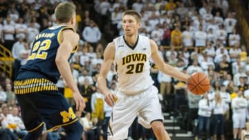 Jan 17, 2016; Iowa City, IA, USA; Iowa Hawkeyes forward Jarrod Uthoff (20) controls the ball as Michigan Wolverines guard Duncan Robinson (22) defends during the second half at Carver-Hawkeye Arena. Iowa won 82-71. Mandatory Credit: Jeffrey Becker-USA TODAY Sports