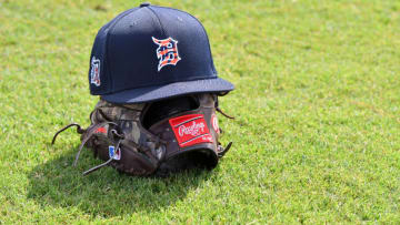 LAKELAND, FL - FEBRUARY 12: A detailed view of a Detroit Tigers baseball hat and Rawlings glove sitting on the field during Spring Training workouts at the TigerTown Facility on February 12, 2020 in Lakeland, Florida. (Photo by Mark Cunningham/MLB Photos via Getty Images)