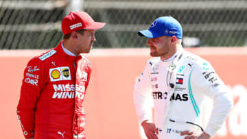 BARCELONA, SPAIN - MAY 11: Pole position qualifier Valtteri Bottas of Finland and Mercedes GP talks with third place qualifier Sebastian Vettel of Germany and Ferrari (Photo by Mark Thompson/Getty Images)