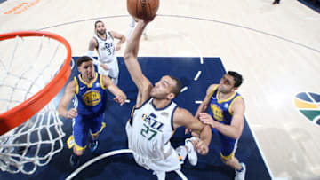 SALT LAKE CITY, UT - APRIL 10: Rudy Gobert #27 of the Utah Jazz grabs the rebound against the Golden State Warriors on April 10, 2018 at vivint.SmartHome Arena in Salt Lake City, Utah. NOTE TO USER: User expressly acknowledges and agrees that, by downloading and or using this Photograph, User is consenting to the terms and conditions of the Getty Images License Agreement. Mandatory Copyright Notice: Copyright 2018 NBAE (Photo by Melissa Majchrzak/NBAE via Getty Images)