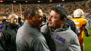 KNOXVILLE, TN - NOVEMBER 18: Head coach Ed Orgeron of the LSU Tigers shakes hands with interim head coach Brady Hoke of the Tennessee Volunteers after the game at Neyland Stadium on November 18, 2017 in Knoxville, Tennessee. (Photo by Michael Reaves/Getty Images)