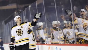 Oct 17, 2016; Winnipeg, Manitoba, CAN; Boston Bruins defenseman Zdeno Chara (33) throws a puck to a young fan prior to the game against Winnipeg Jets at MTS Centre. Mandatory Credit: Bruce Fedyck-USA TODAY Sports