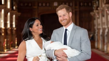 WINDSOR, ENGLAND - MAY 08: Prince Harry, Duke of Sussex and Meghan, Duchess of Sussex, pose with their newborn son Prince Archie Harrison Mountbatten-Windsor during a photocall in St George's Hall at Windsor Castle on May 8, 2019 in Windsor, England. The Duchess of Sussex gave birth at 05:26 on Monday 06 May, 2019. (Photo by Dominic Lipinski - WPA Pool/Getty Images)