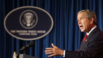 CRAWFORD, TX - DECEMBER 29: (AFP OUT) U.S. President George W. Bush answers questions during a news conference at his ranch December 29, 2004 near Crawford, Texas. President Bush spoke on a large number of issues including the aid for the Tsunami victims, Iraq elections as well as flooding on the West Coast. (Photo by Rod Aydelotte-Pool/Getty Images)